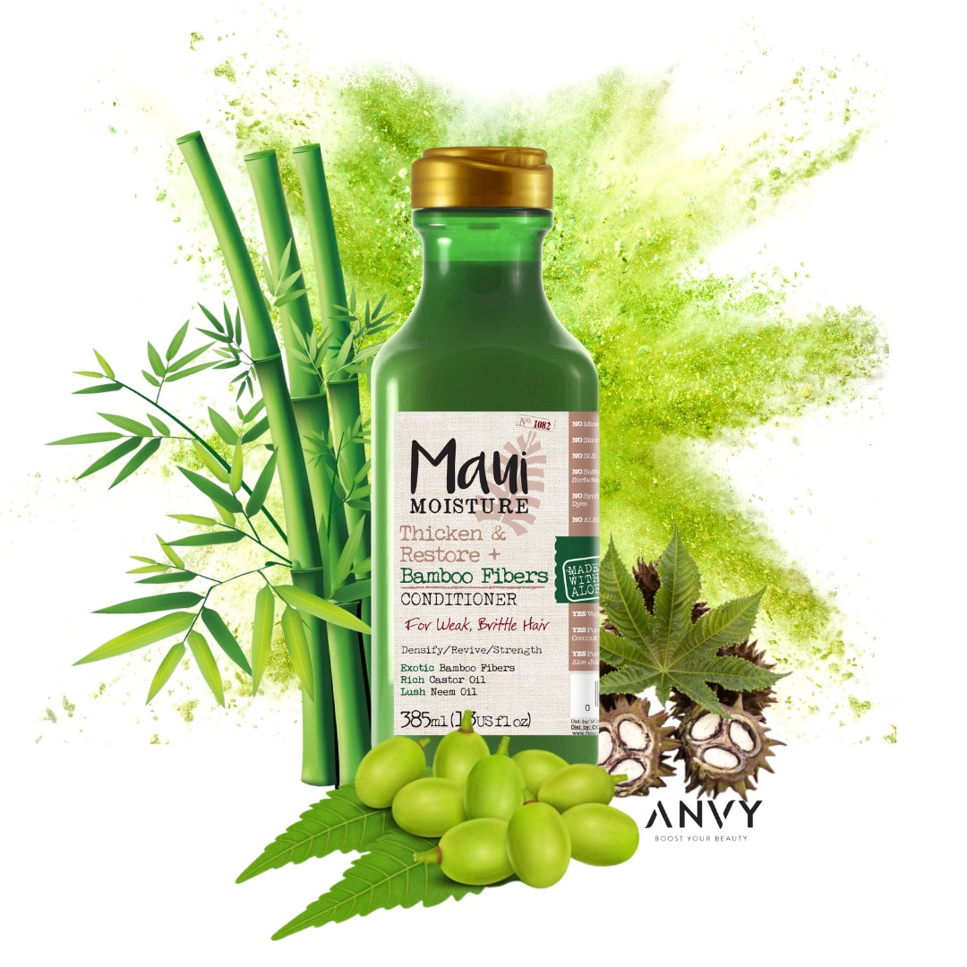 Thicken & Restore + Bamboo Fiber Conditioner van Maui Moisture in een groene fles met een gouden dop, omringd door bamboe...