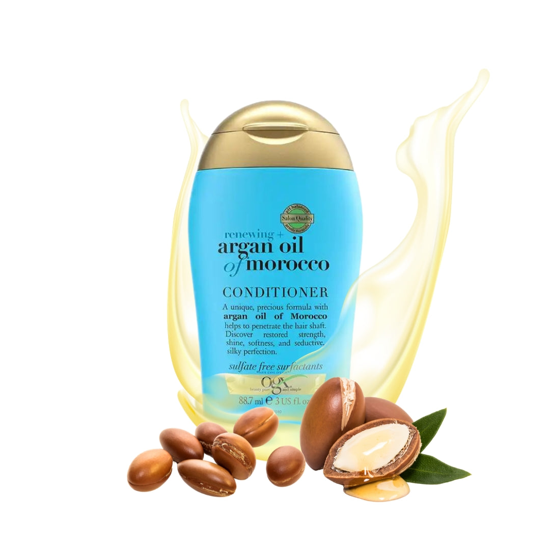 Travel Ren. Argan Oil Of Morocco Conditioner in een blauwe fles met gouden dop, omringd door argannoten en olie.
