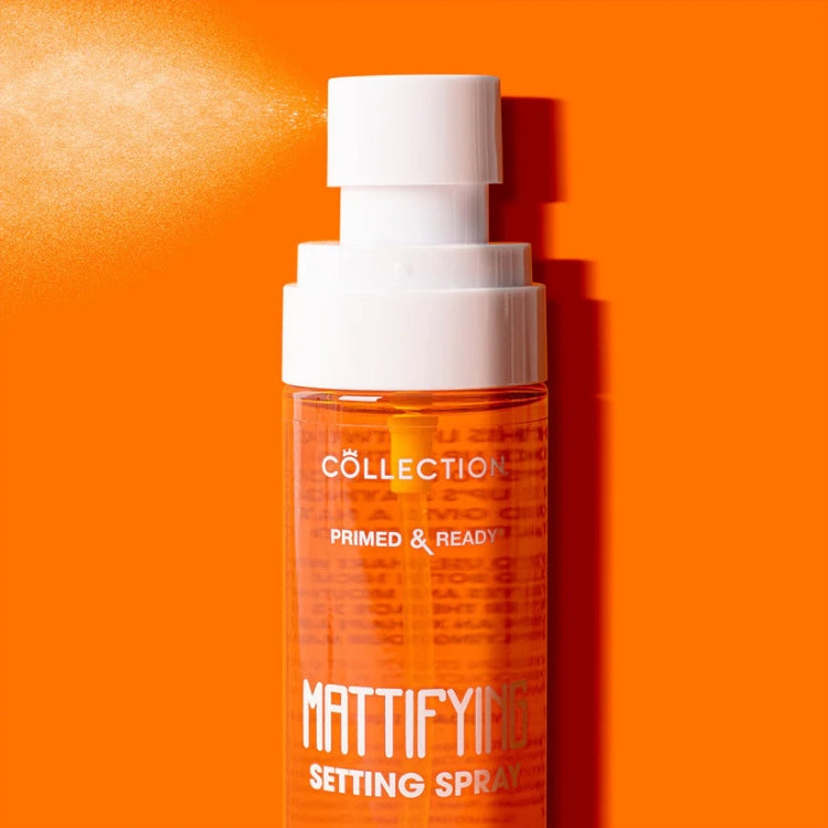 Primed & Ready Mattifying Setting Spray in een transparante oranje fles met een witte spraydop.