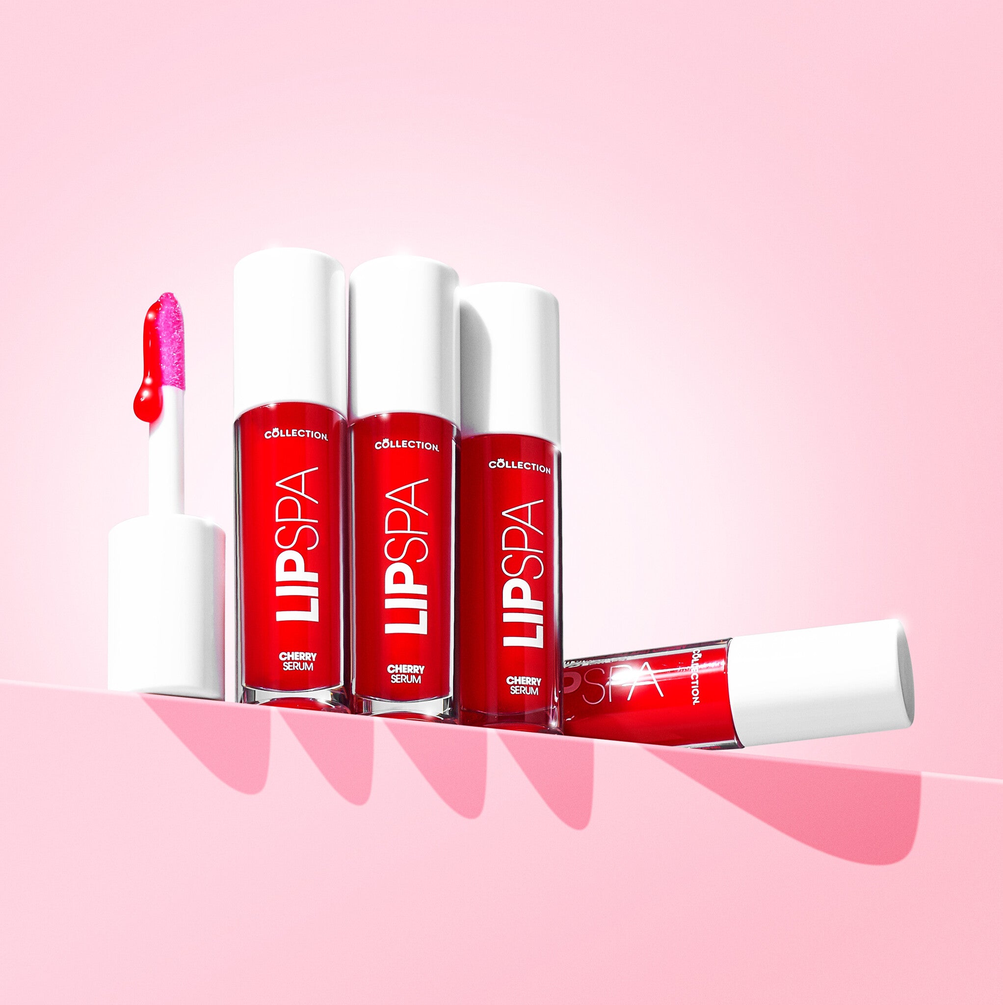 Lip Spa Lip Serum - Pink Pout in heldere rode verpakking met applicator, perfect voor een glanzende liplook.