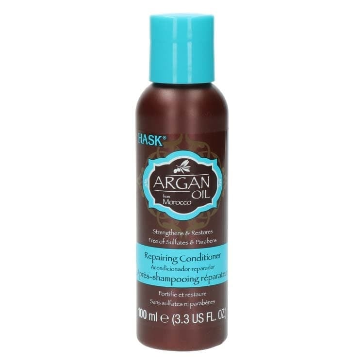 Argan Oil Repairing Conditioner Travelsize van Hask in een bruine fles met turquoise dop, ideaal voor onderweg.