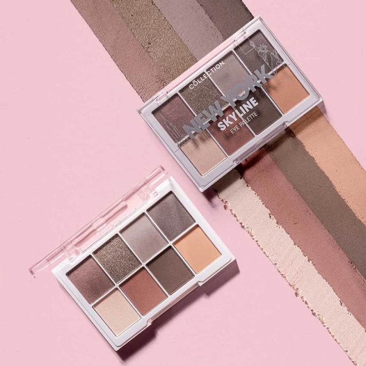 Eye Palette - New York Skyline met neutrale tinten in een transparante verpakking, naast kleurstalen op een roze achtergrond.