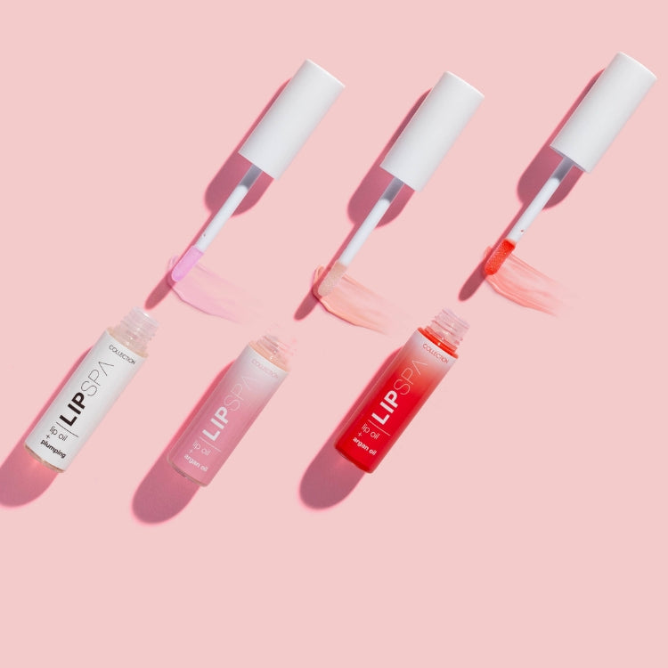 Lip Spa Lip Oil in drie kleuren: lichtroze, roze en koraal, met een stijlvolle verpakking en applicator.