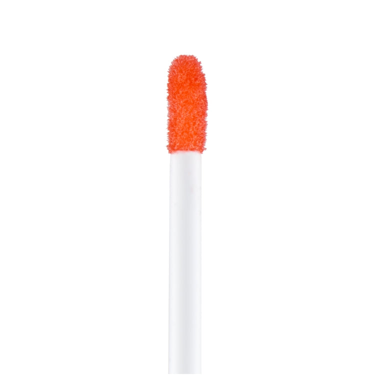 Lip Spa Lip Oil in een heldere oranje tint met een zachte applicator voor een glanzende finish.